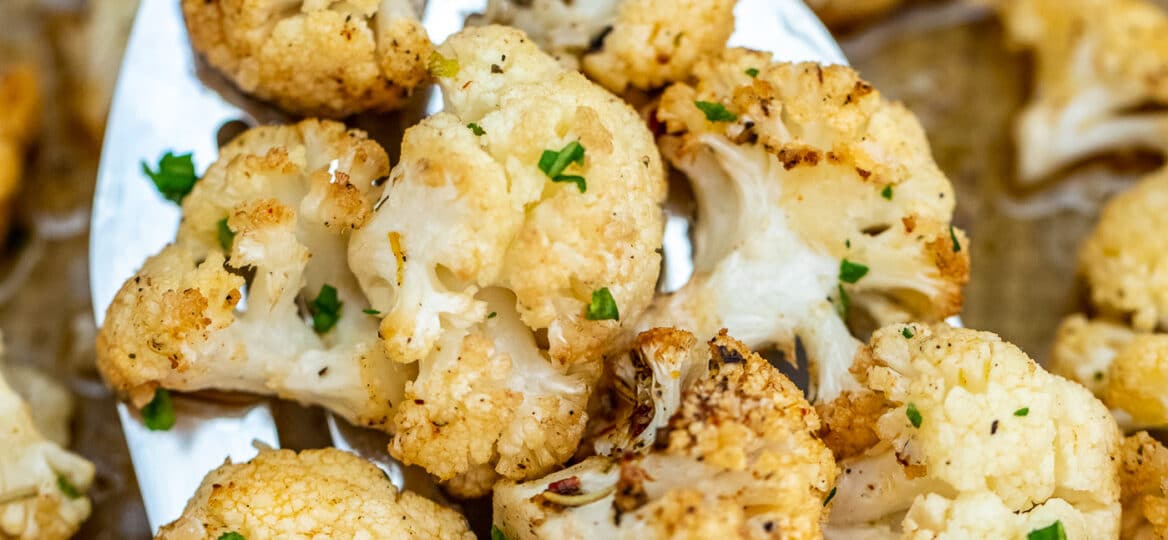This Roasted Cauliflower recipe gives the veggie a lift in terms of flavors and texture! Prepare this side dish in under 20 minutes with this easy recipe! #cauliflower #sidedish #vegetarian #sweetandsavorymeals #healthyrecipes