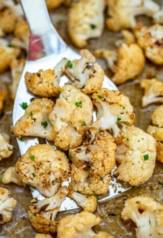 This Roasted Cauliflower recipe gives the veggie a lift in terms of flavors and texture! Prepare this side dish in under 20 minutes with this easy recipe! #cauliflower #sidedish #vegetarian #sweetandsavorymeals #healthyrecipes