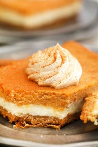 Sweet Potato Cheesecake Bars have layers full of creamy goodness! Topped with a cinnamon whipped cream, this dessert will never fail to please a crowd! #cheesecake #sweetpotatoes #thanksgiving #thanksgivingrecipes #fallrecipes #sweetandsavorymeals