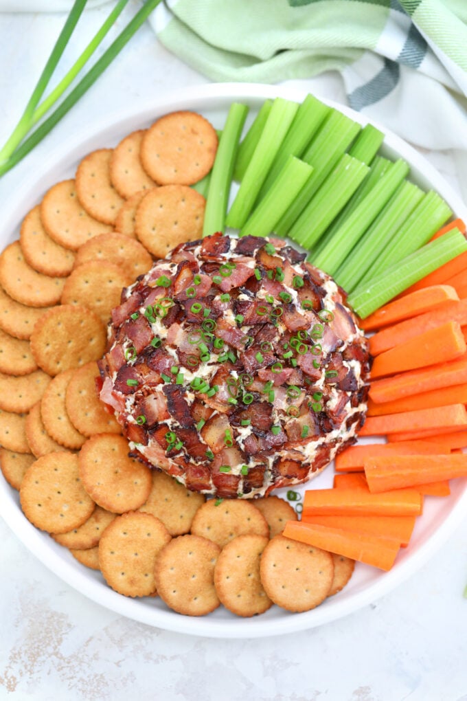 Bacon Ranch Cheese Ball is a creamy and flavorful ball of your favorite cheese combined with cream cheese and crispy bacon! #cheese #cheeseball #appetizers #baconranch #sweetandsavorymeals