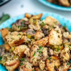 Crockpot Stuffing is moist, hearty, and perfectly seasoned! Easy to prepare using the slow cooker, it makes the perfect Thanksgiving side dish! #stuffing #crockpotrecipes #slowcooker #thanksgivingrecipes #sweetandsavorymeals