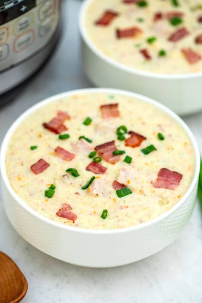 Image of instant pot ham and potato soup in a white bowl.