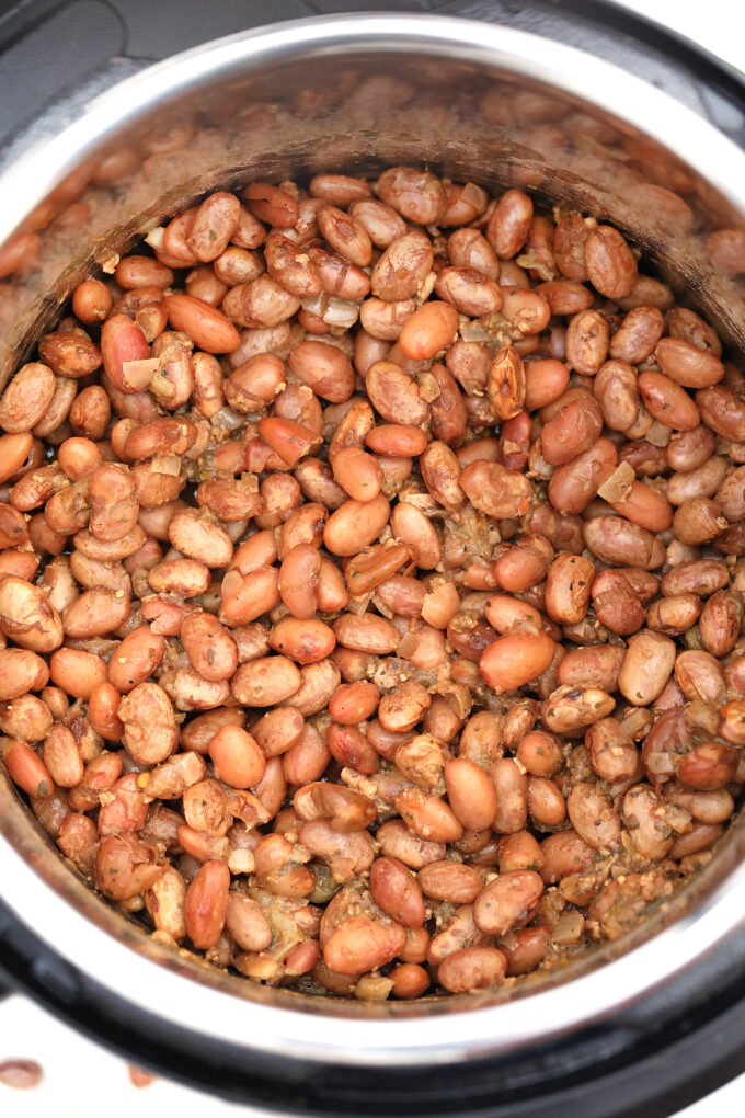 Instant Pot Refried Beans make for a great side dish that has that Mexican flair we are all crazy about. Homemade and quick, this recipe is a winner! #instantpot #pressurecooker #refriedbeans #beans #sweetandsavorymeals