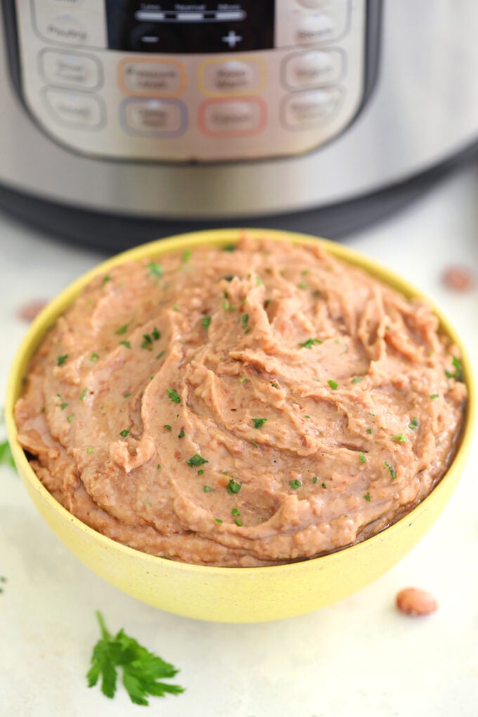 Instant Pot Refried Beans make for a great side dish that has that Mexican flair we are all crazy about. Homemade and quick, this recipe is a winner! #instantpot #pressurecooker #refriedbeans #beans #sweetandsavorymeals
