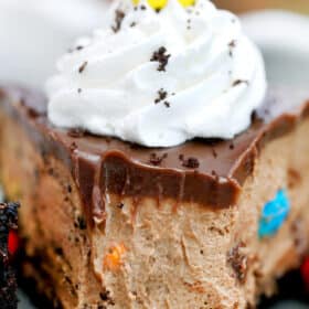 No-Bake M&M's Pie with Oreo crust is creamy, nutty, and chocolaty! It is so colorful and festive that it makes for a great dessert for kids and the kids-at-heart! #halloween #nobake #pie #chocolatepie #sweetandsavorymeals