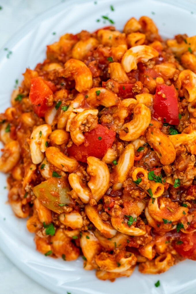 Goulash is a traditional Hungarian recipe that has an American version that is equally hearty and delicious! It is the perfect comfort food for the cold season! #goulash #onepotrecipe #pasta #sweetandsavorymeals #30minutemeals