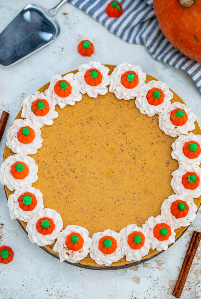 overhead shot of homemade pumpkin cheesecake on a table