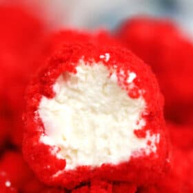 Red Velvet Cheesecake Bites are creamy and nothing but velvety! With their festive color and decadent taste, they make for a great dessert for any occasion! #cheesecake #cheesecakebites #sweetandsavorymeals #redvelvet #nobake