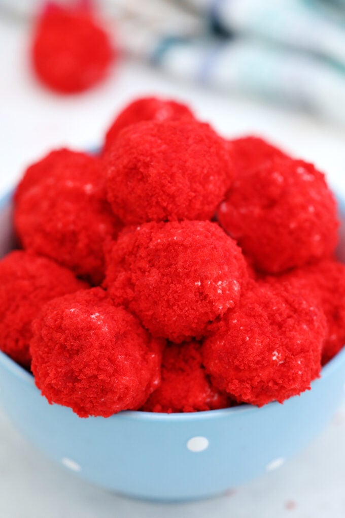 A stack of Red Velvet Cheesecake Bites in a bowl