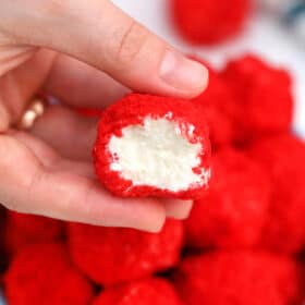 Red Velvet Cheesecake Bites are creamy and nothing but velvety! With their festive color and decadent taste, they make for a great dessert for any occasion! #cheesecake #cheesecakebites #sweetandsavorymeals #redvelvet #nobake
