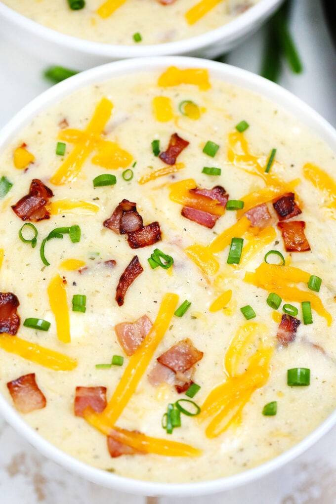 Slow Cooker Bacon Ranch Potato Soup gives a twist to the traditional version. It tastes amazing with the ranch flavor making it definitely worth a try! #soup #crockpotrecipes #slowcookerrecipes #sweetandsavorymeals #souprecipes