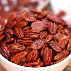 Candied Pecans are great for snacking, desserts and even salads! This recipe makes sure that the nuts are not sticky, but crunchy, and perfectly spiced! #pecans #candiedpecans #sweetandsavorymeals #easyrecipes #fallrecipes
