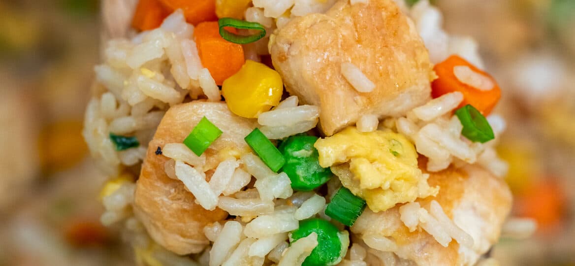 Chicken Fried Rice is a hearty and savory dinner option for the whole family! Follow this recipe for a homemade version of your favorite Chinese takeout! #chickenrecipes #asianrecipes #friedrice #sweetandsavorymeals #chineserecipes