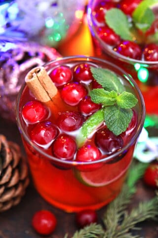 Christmas Punch is a festive, and refreshing drink that is made with pomegranate, lime, and cranberries, and ready in 5 minutes. #christmaspunch #punchrecipe #christmas #christmasrecipes #sweetandsavorymeals