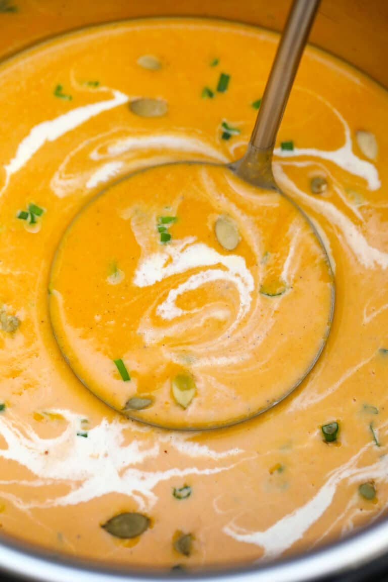 Instant Pot Roasted Butternut Squash Soup is creamy, hearty, and ready in just a few minutes in the pressure cooker! Making this winter favorite is so easy! #instantpot #pressurecooker #butternutsquash #souprecipes #sweetandsavorymeals