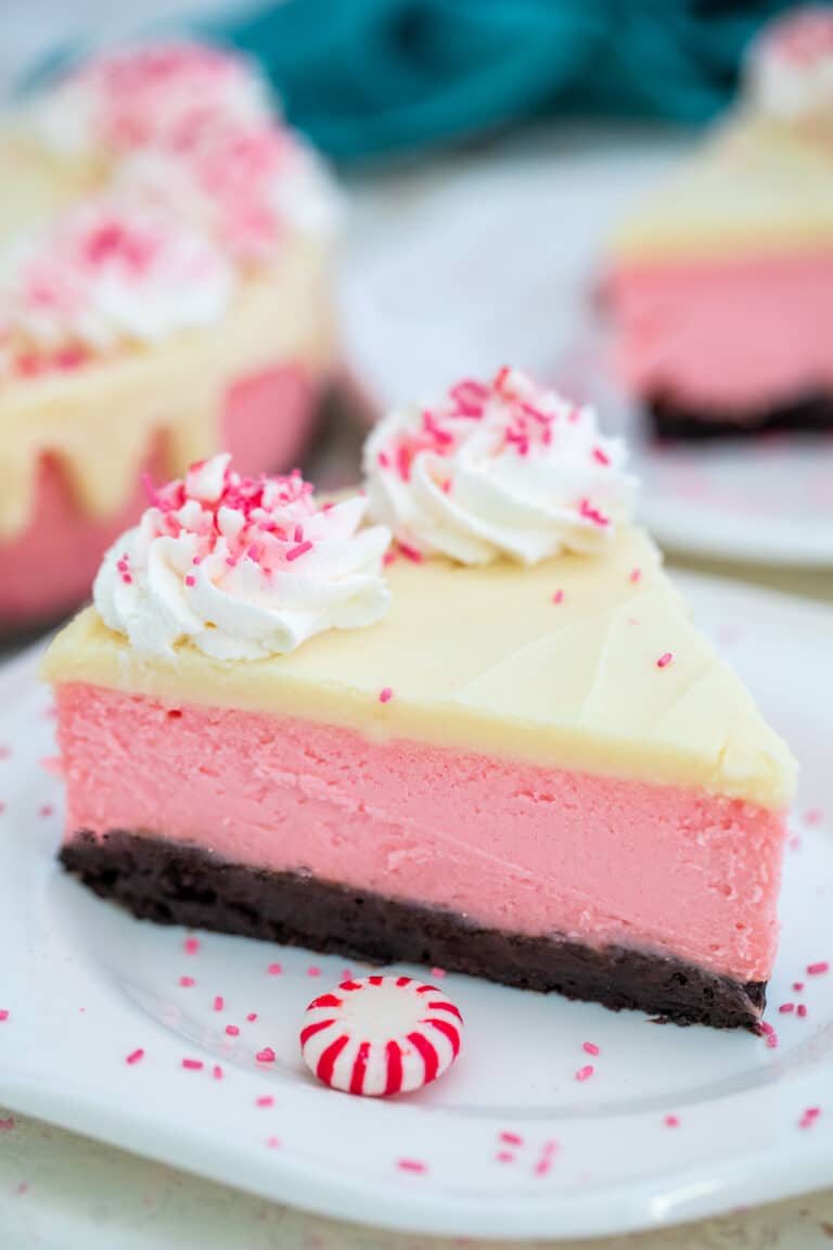 Peppermint Cheesecake is the most festive dessert this Christmas! It is not your ordinary dessert. It is rich, decadent, and refreshingly unique! #cheesecake #peppermint #christmasrecipes #christmasdesserts #sweetandsavorymeals