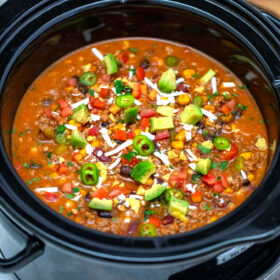 Slow Cooker Taco Soup is made hassle-free with this easy recipe! It is a great freezer meal you can enjoy anytime! #tacosoup #souprecipes #sweetandsavorymeals #slowcookerrecipes #crockpotrecipes