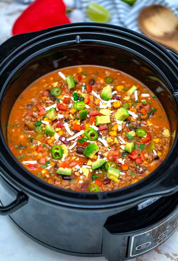 Slow Cooker Taco Soup is made hassle-free with this easy recipe! It is a great freezer meal you can enjoy anytime! #tacosoup #souprecipes #sweetandsavorymeals #slowcookerrecipes #crockpotrecipes