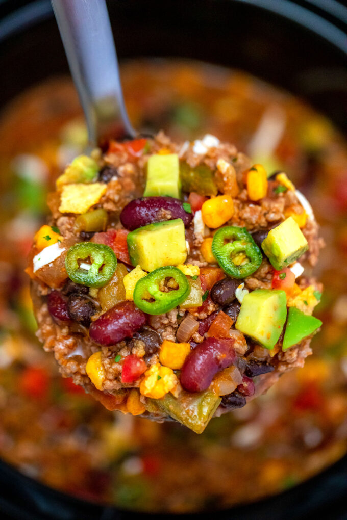 Slow Cooker Taco Soup is made hassle-free with this easy recipe! It is a great freezer meal you can enjoy anytime! #tacosoup #souprecipes #sweetandsavorymeals #slowcookerrecipes #crockpotrecipes