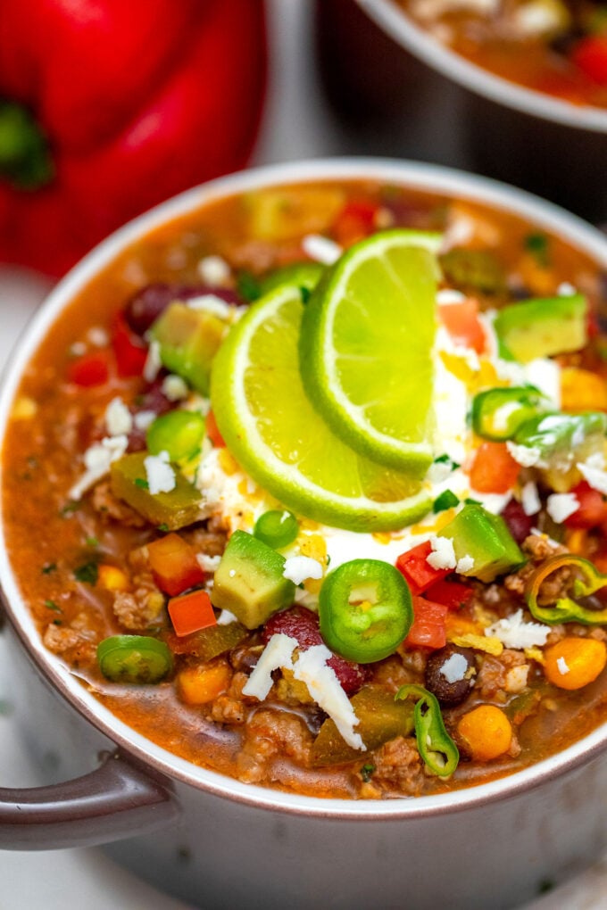 Slow Cooker Taco Soup is made hassle-free with this easy recipe! It is a great freezer meal you can enjoy anytime! #tacosoup #souprecipes #sweetandsavorymeals #slowcookerrecipes #crockpotrecipes