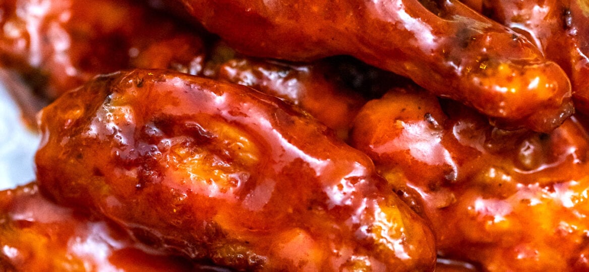 Baked Buffalo Wings are super crispy and coated in a delicious homemade spicy sauce. They are the perfect snack or party food! #buffalo #chickenwings #buffalosauce #partyfood #fingerfood #sweetandsavorymeals