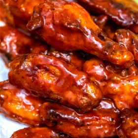 Baked Buffalo Wings are super crispy and coated in a delicious homemade spicy sauce. They are the perfect snack or party food! #buffalo #chickenwings #buffalosauce #partyfood #fingerfood #sweetandsavorymeals