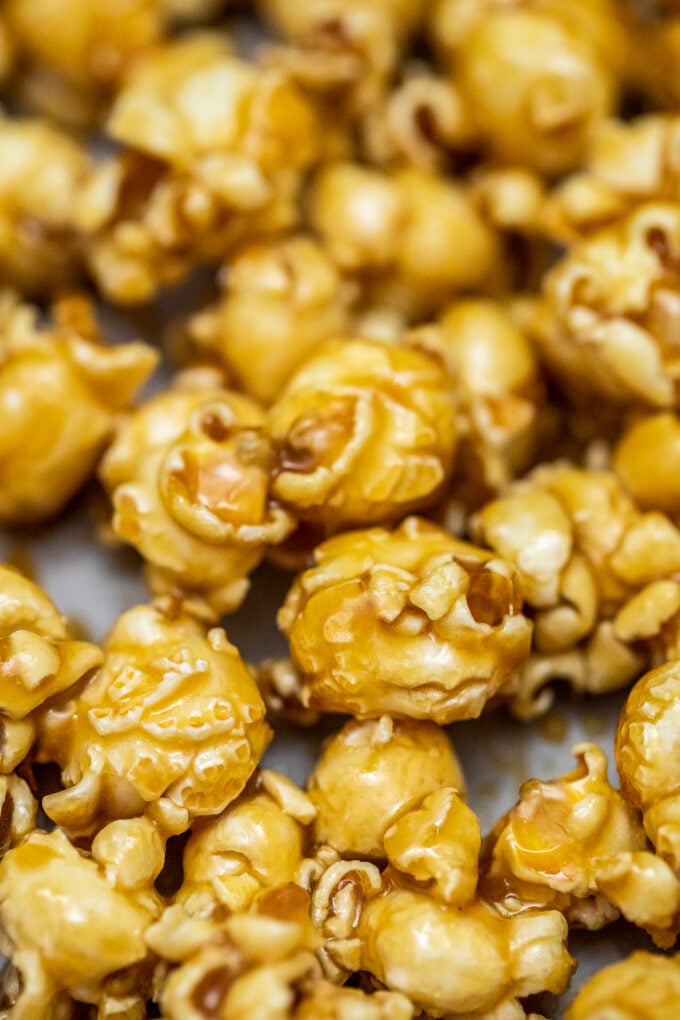 Caramel Popcorn is sweet with just the right balance of crunch and chewiness! Prepare a huge batch of this favorite snack for your next movie night! #caramel #popcorn #caramelpopcorn #snacks #sweetandsavorymeals