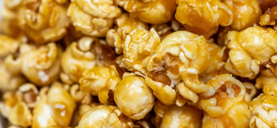 Caramel Popcorn is sweet with just the right balance of crunch and chewiness! Prepare a huge batch of this favorite snack for your next movie night! #caramel #popcorn #caramelpopcorn #snacks #sweetandsavorymeals