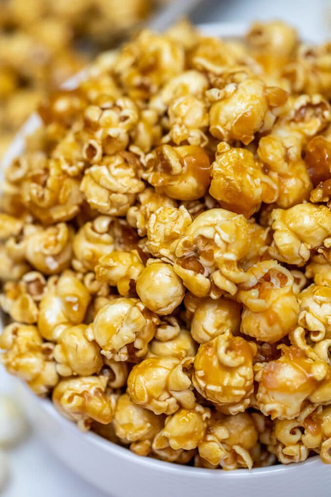 Caramel Popcorn is sweet with just the right balance of crunch and chewiness! Prepare a huge batch of this favorite snack for your next movie night! #caramel #popcorn #caramelpopcorn #snacks #sweetandsavorymeals