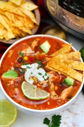 Instant Pot Chicken Tortilla Soup has all your favorite Mexican flavors in one appetizing dish! It is easily prepared using this pressure cooker recipe! #pressurecooker #instantpot #souprecipes #mexicanrecipes #sweetandsavorymeals