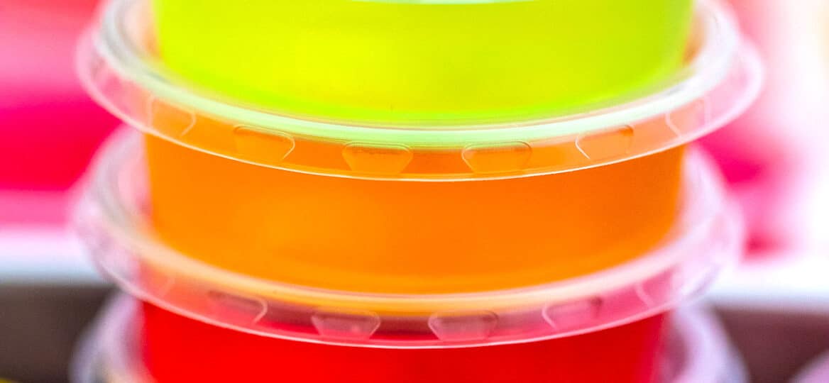 Jello Shots are colorful, and the perfect party cocktail that adults will love! These are pure fun in the form of flavorful jelly! #jello #jelloshots #partyrecipes #sweetandsavorymeals #partyfood