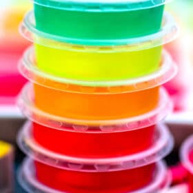 Jello Shots are colorful, and the perfect party cocktail that adults will love! These are pure fun in the form of flavorful jelly! #jello #jelloshots #partyrecipes #sweetandsavorymeals #partyfood