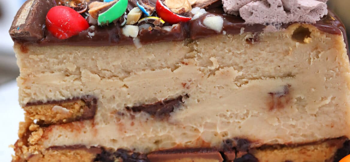Peanut Butter Cheesecake with Reese's cups is one of the best desserts you will ever make! #peanutbutter #cheesecake #peanutbuttercheesecake #sweetandsavorymeals #cakerecipes