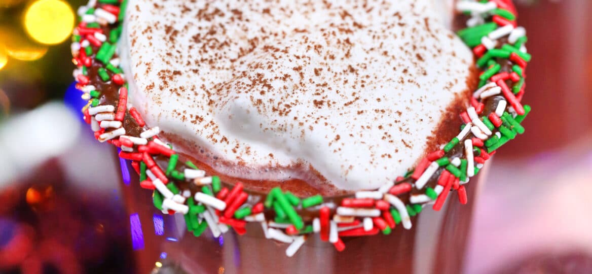 Red Velvet Hot Chocolate is luxurious and rich, topped with a dollop of whipped cream, and the perfect holiday treat. #hotchocolate #redvelvet #christmasrecipes #valentinesdayrecipes #sweetandsavorymeals