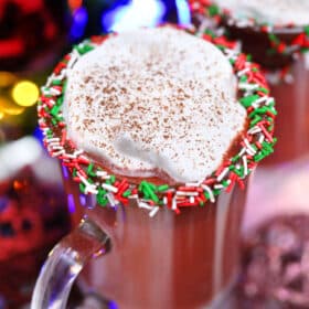 Red Velvet Hot Chocolate is luxurious and rich, topped with a dollop of whipped cream, and the perfect holiday treat. #hotchocolate #redvelvet #christmasrecipes #valentinesdayrecipes #sweetandsavorymeals