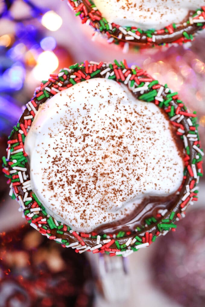 Red Velvet Hot Chocolate is luxurious and rich, topped with a dollop of whipped cream, and the perfect holiday treat. #hotchocolate #redvelvet #christmasrecipes #valentinesdayrecipes #sweetandsavorymeals