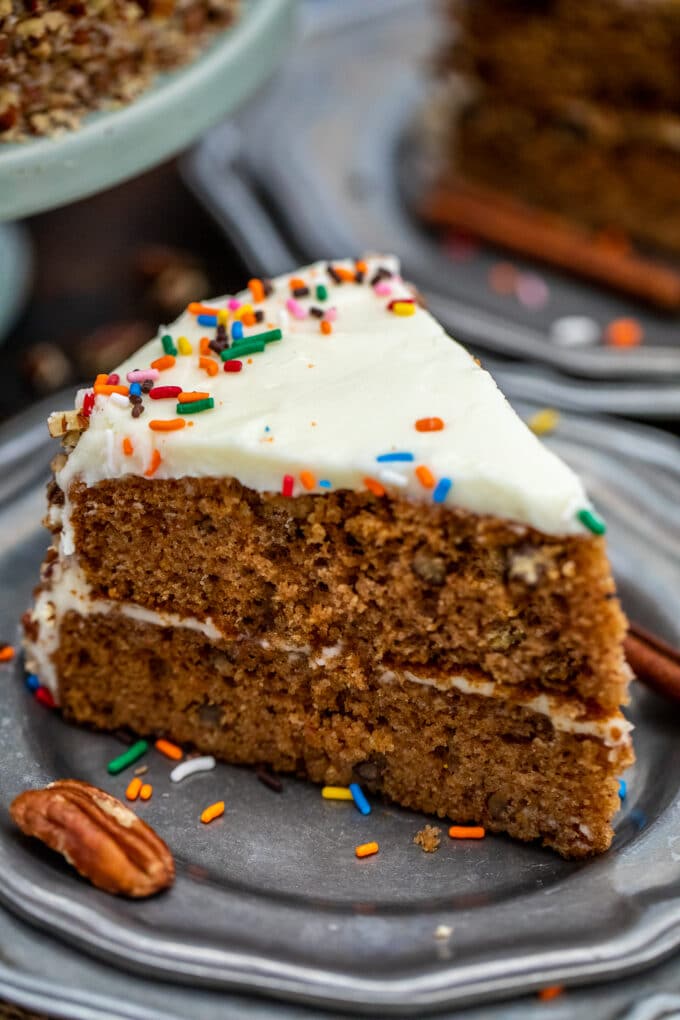 image of a slice of spice cake and pecan on a silver plate