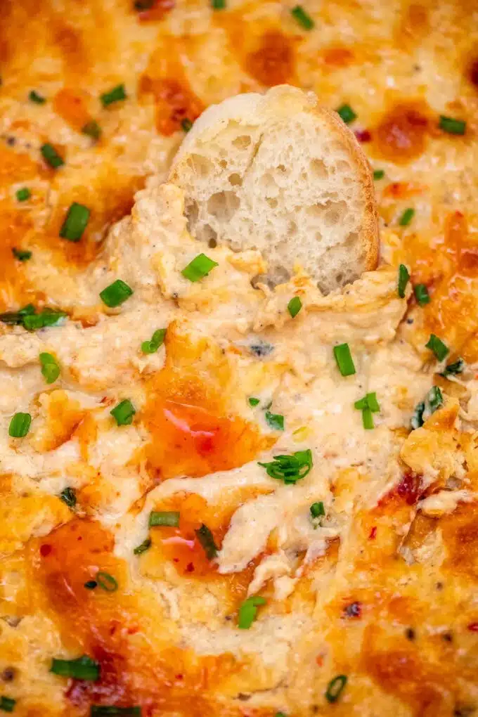 Crab Dip is cheesy, hearty, savory, and tasty! This easy recipe will make every party or game night even more exciting and your guests will love it for sure! #cheesedip #crabdip #dip #sweetandsavorymeals #partyfood #gamedayfood