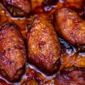 Honey Garlic Chicken Wings are perfectly sweet and savory at the same time! Better than take-out, try this dish for a finger-licking good meal! #wings #honeygarlicwings #chickenwings #partyfood #sweetandsavorymeals #honeygarlic