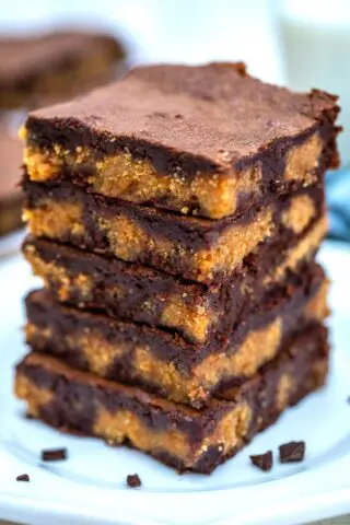 Peanut Butter Brownies are chewy, moist, and made rich with a layer of peanut butter filling! #brownies #peanutbutter #brownierecipe #sweetandsavorymeals #dessertrecipes