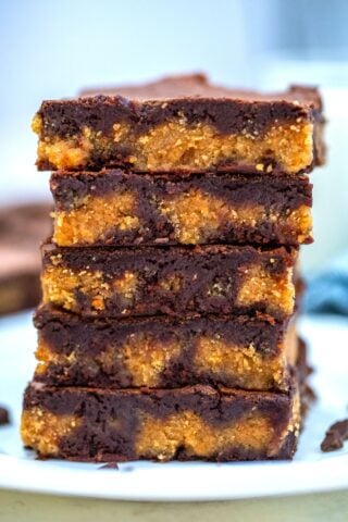 Peanut Butter Brownies are chewy, moist, and made rich with a layer of peanut butter filling! #brownies #peanutbutter #brownierecipe #sweetandsavorymeals #dessertrecipes