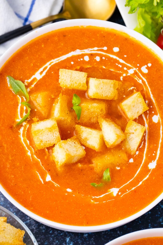 A bowl of Instant Pot tomato bisque topped with croutons.