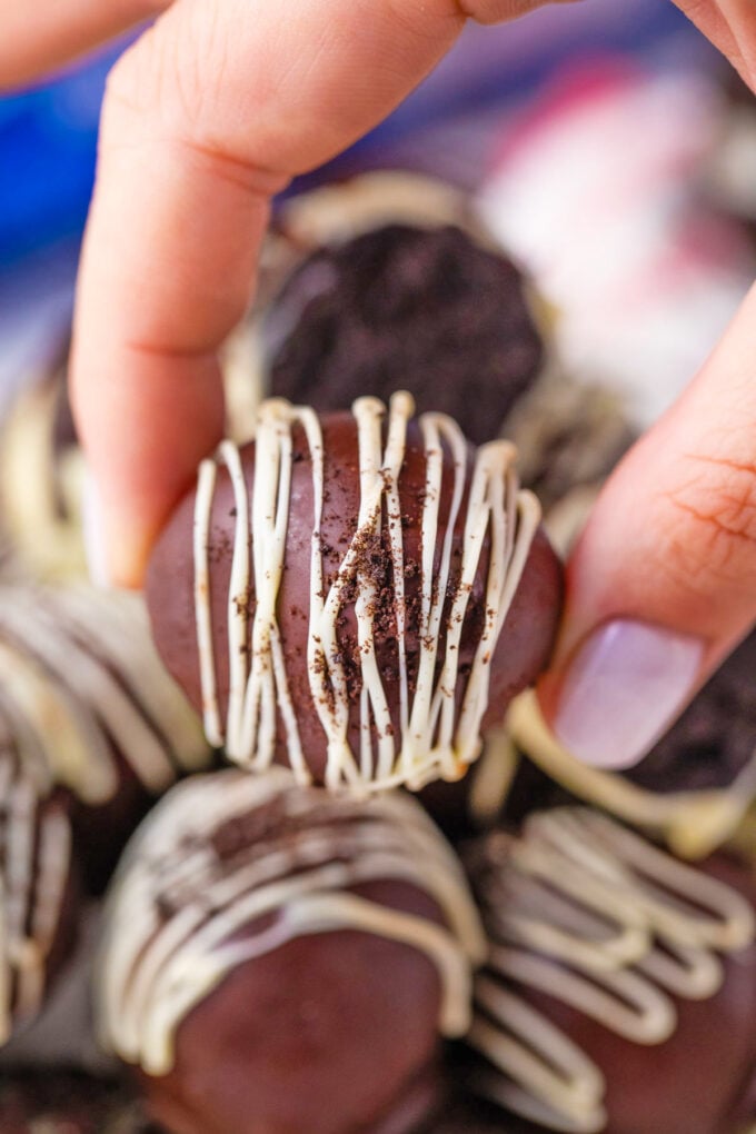 Holding a homemade no-bake Oreo ball.