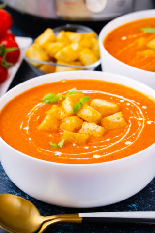 A bowl of very creamy, homemade Instant Pot tomato bisque.