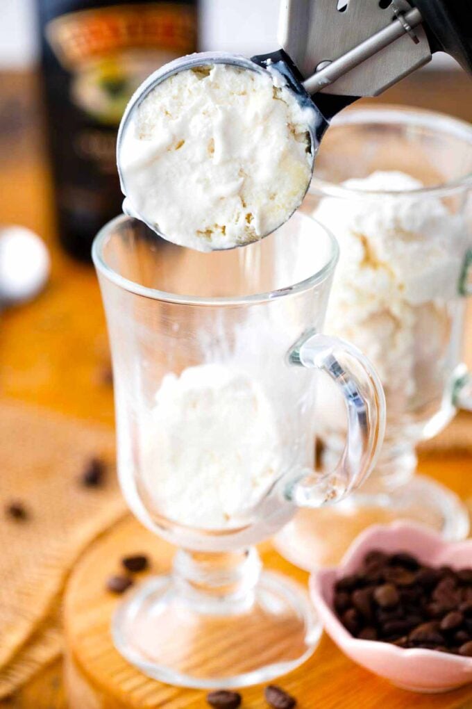 adding ice cream to an Irish coffee mug