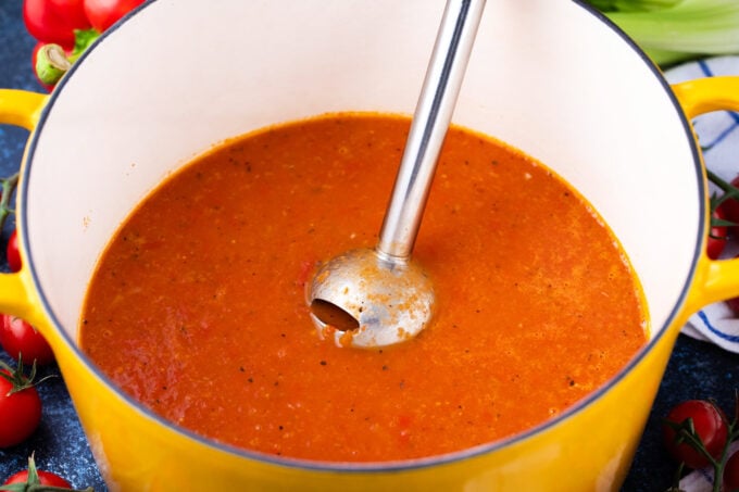 Pureeing homemade tomato bisque.