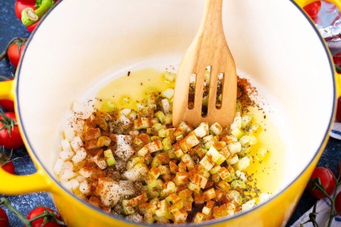 Sautéing onion and garlic with aromatics.