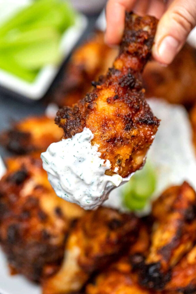 crispy fried chicken drumstick dipped in a tzatziki sauce