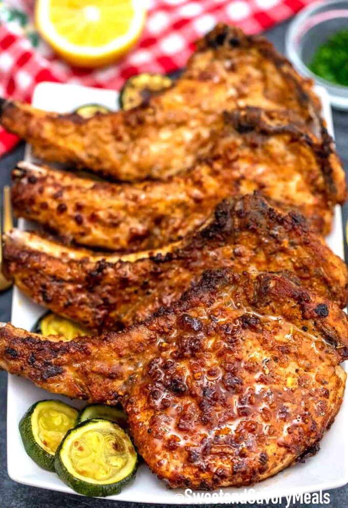 air fried pork chops on a plate with zucchini