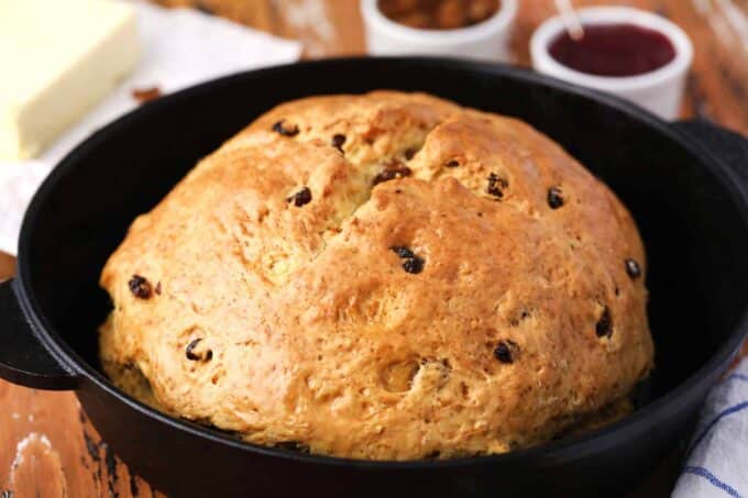 golden brown Irish soda bread in a cast iron skillet